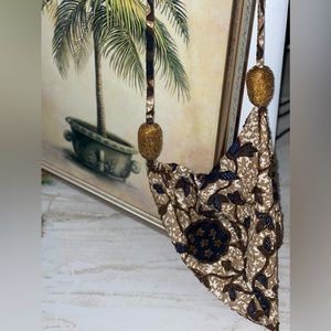Triangular cloth bag with beaded details
